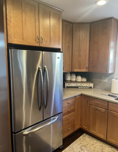 Original kitchen cabinets and refrigerator before remodeling in Cameron Park, CA
